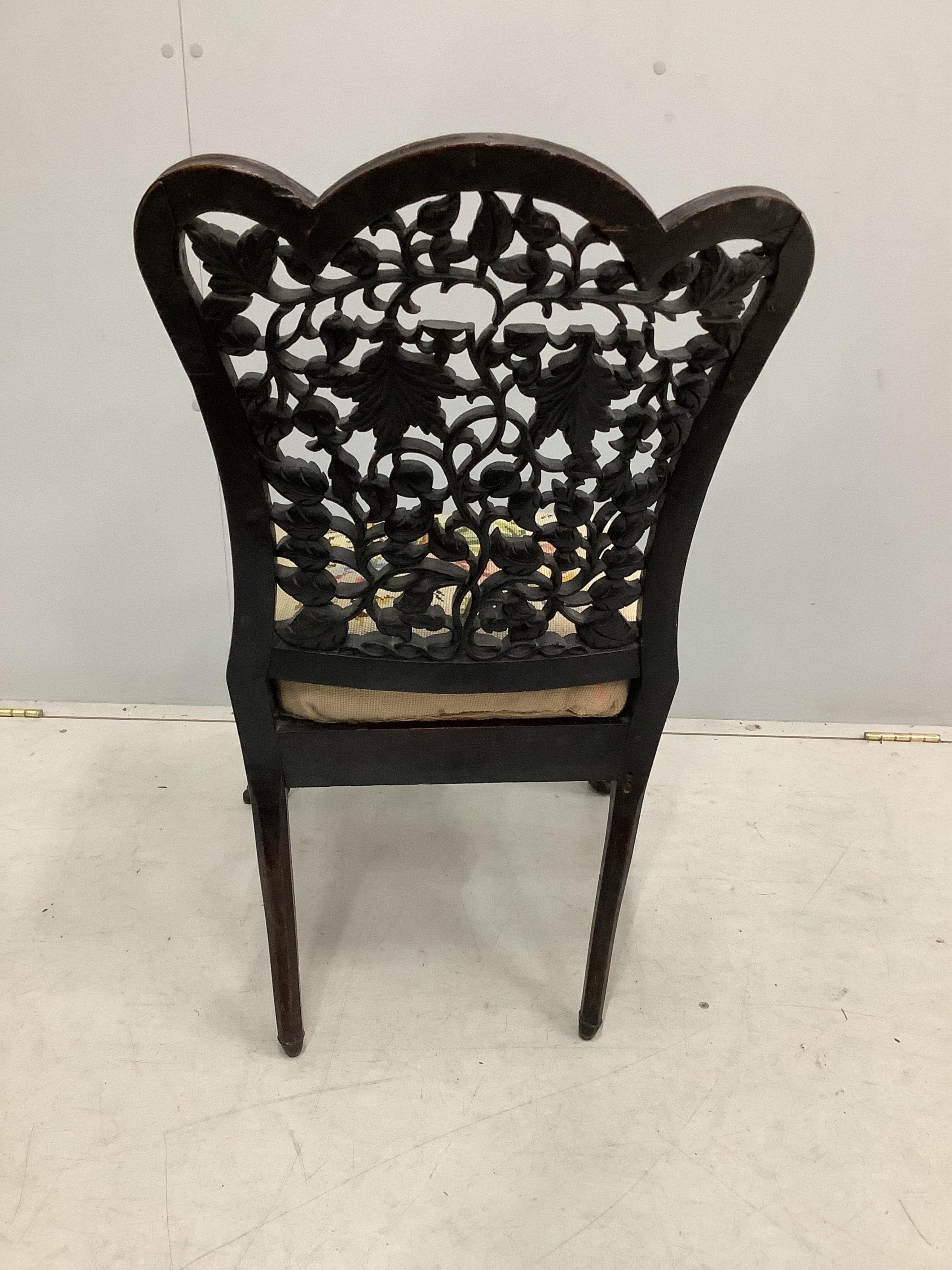 An Anglo Indian carved hardwood side chair with tapestry seat, height 81cm